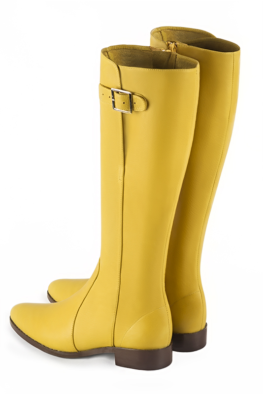 Yellow women's knee-high boots with buckles. Round toe. Flat leather soles. Made to measure. Rear view - Florence KOOIJMAN